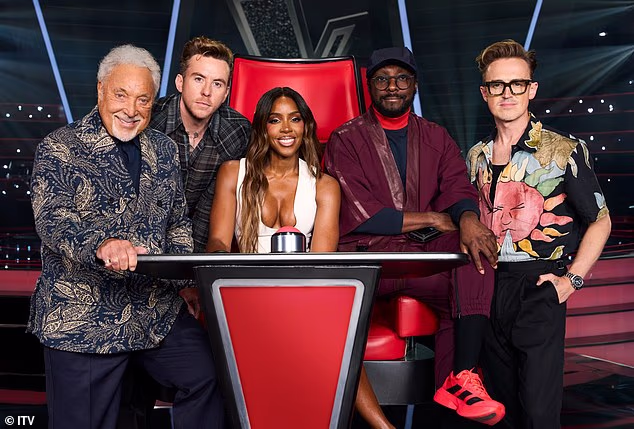How The Voice UK has been plagued by toxic in-fighting, 'fix' accusations and a never-ending parade of coaches - as Tom Jones' sacking marks another bum note for struggling show (L-R coaches Sir Tom, Danny Jones, Kelly Rowland, Will.i.am and Tom Fletcher)
