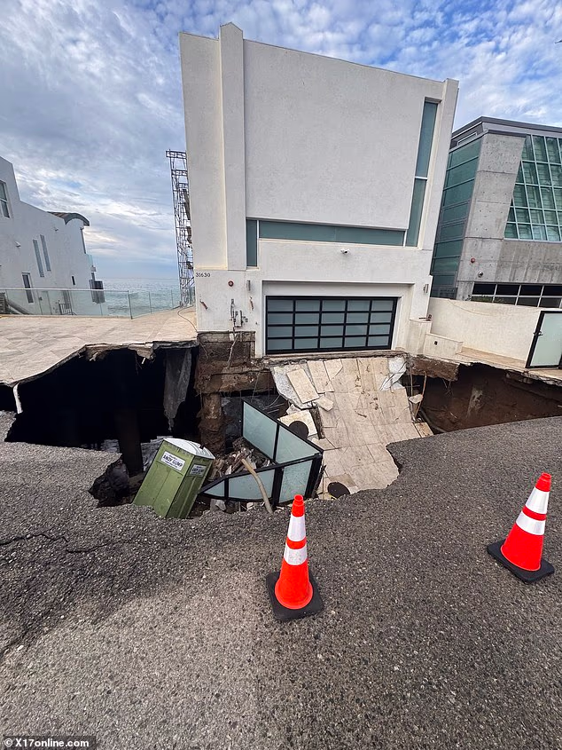 Nicolas Cage's Malibu mansion has been afflicted by a massive sinkhole that has swallowed the driveway of the beachfront home