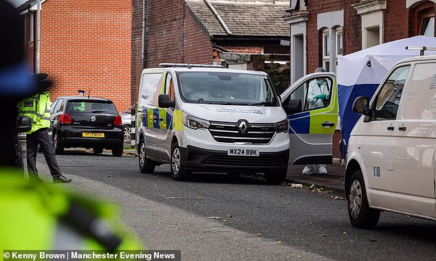 Police and forensics continue to investigate the scene in Blackburn, where an elderly couple were found stabbed to death in their home