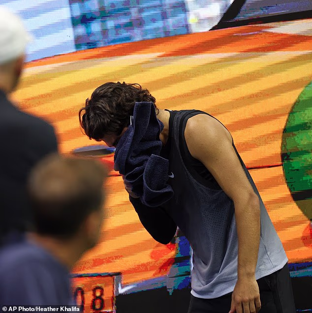 Carlos Alcaraz was seen throwing up into a towel as he was knocked out of the US Open