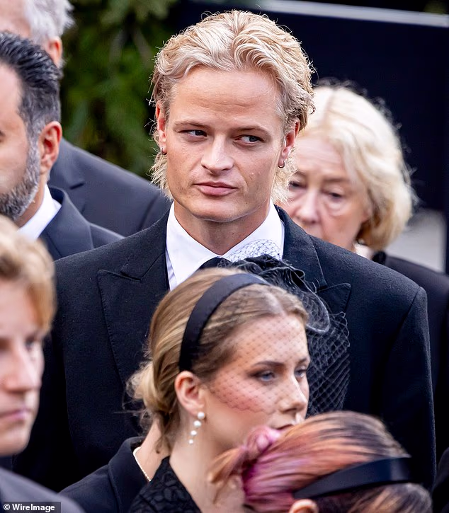 The disgraced stepson of Norway's new monarch appeared to be shunned by his step-grandmother Queen Sonja at the funeral of her husband King Harald V's on Wednesday. Pictured, Marius Borg Høiby