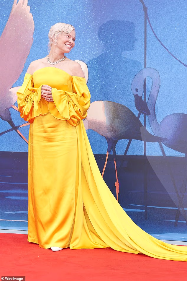 Pamela Anderson nailed Hollywood glamour in a mustard yellow gown at the screening of A Place To Be during Venice Film Festival on Wednesday