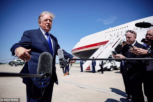 President Donald Trump speaks to the media before boarding Air Force One for a trip to the Republican National Midterm Convention, at Joint Base Andrews, Maryland,