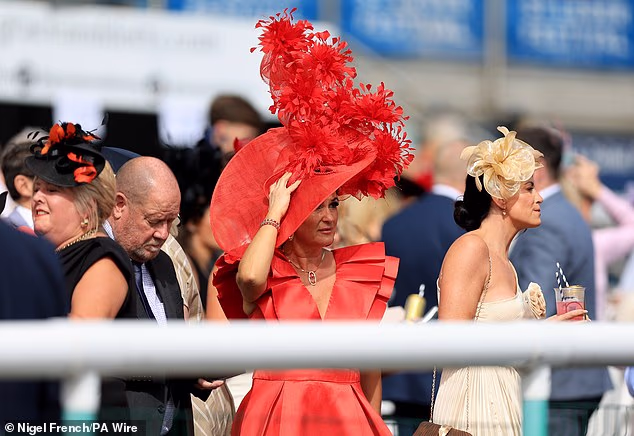Glamorous racegoers upped the fashion stakes as they brought the glitz and glamour to the Betfred St Leger Festival in Doncaster today