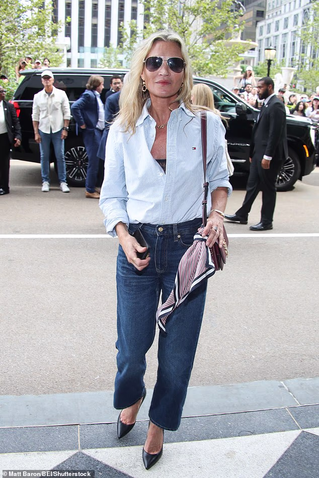 Kate Moss kept it casual as she joined Gigi Hadid and Romeo Beckham at a Tommy Hilfiger show during New York Fashion Week on Thursday