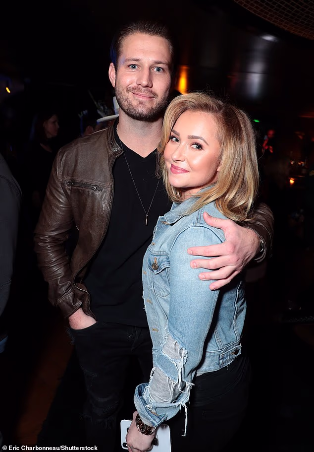Hayden Panettiere's ex-boyfriend Brian Hickerson and his brother Zach appeared to be in a heated exchange with hecklers on Saturday at a Greenville, South Carolina restaurant, prior to police placing him in handcuffs. Above, Hickerson and Panettiere in 2018