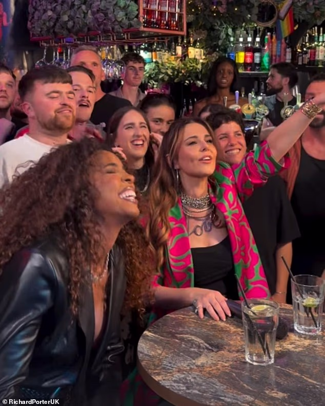 Cheryl belted out hits with The Voice co-star Kelly Rowland as they enjoyed a wild night out at a gay bar in Manchester on Tuesday