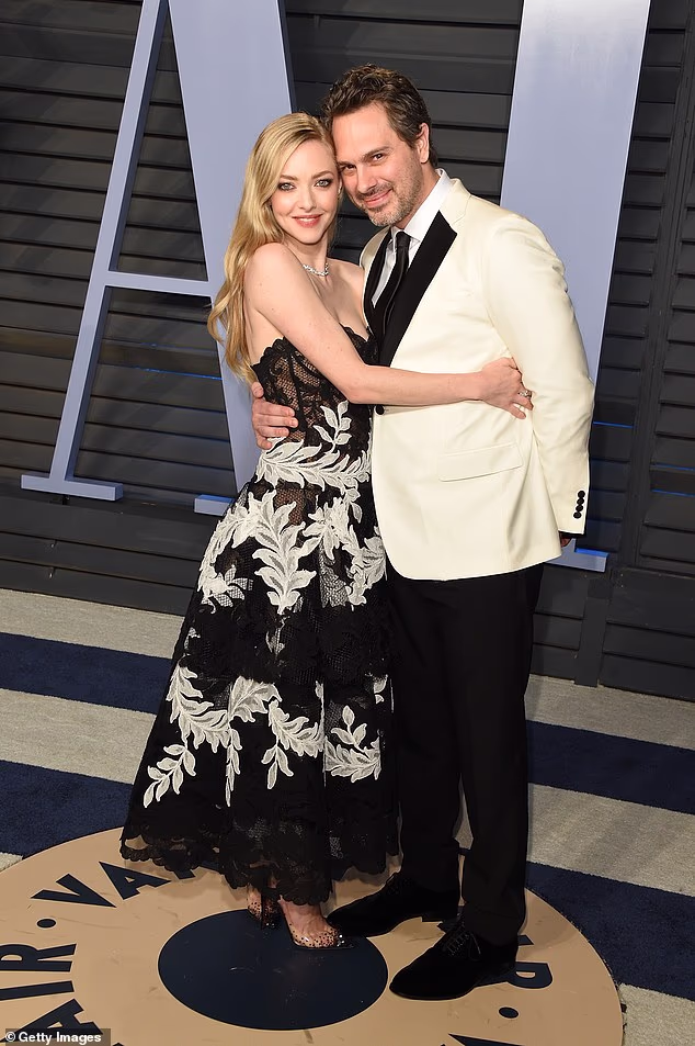 Inside Amanda Seyfried's year from hell as she battled controversies and risk of cancellation while quietly separating from her husband Thomas Sadoski (pictured together in 2018)