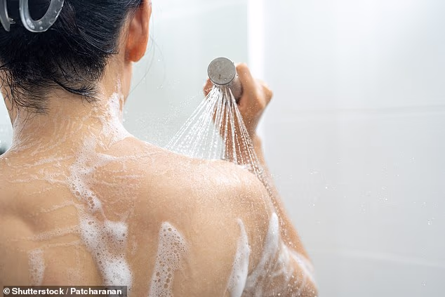 More than half of 18 to 29-year-olds spend at least ten minutes in the shower every day, according to new research (stock image)