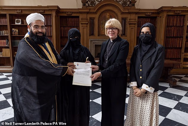 The Archbishop of Canterbury has been accused of sending a 'deeply troubling message' by posing next to the fully-covered wife of Islamic cleric Hafiz Tahir Ashrafi