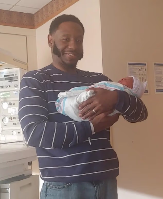 Michael Desronvil, 48, was seen holding his newborn daughter in a photo shared on the GiveSendGo that raised over $360,900 for the holdout juror in Lindsay Clancy's trial