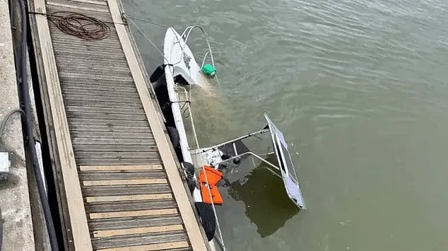 Anti-migrant activist Daniel Thomas's boat called the Patriot is seen here after sinking near Littlehampton Harbour, West Sussex, earlier this year