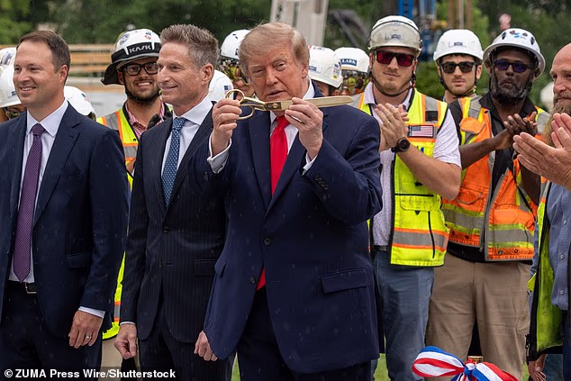 Donald Trump participates in a ribbon-cutting ceremony for the new White House helipad on the South Lawn before boarding the new Marine One on Monday