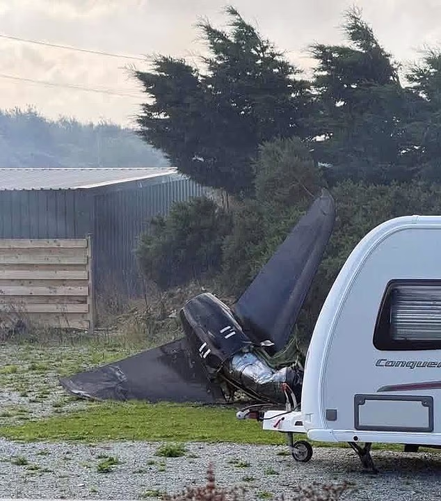 A huge piece of debris, seemingly from the plane's tail, landed just yards from a caravan