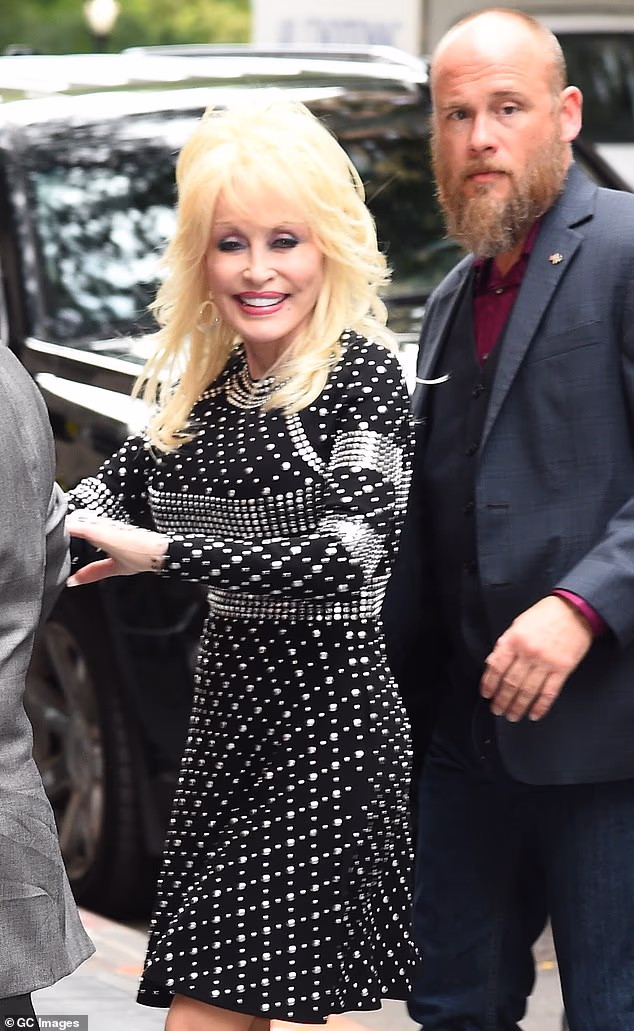 Dolly Parton's nephew Bryan Seaver has issued a withering response to her manager Danny Nozell in their escalating legal battle over her estate; Parton and Seaver pictured in 2017