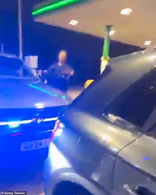 Danny Tommo is arrested at a petrol station for criminal damage after filming himself slashing Channel dinghy with rescuer on board