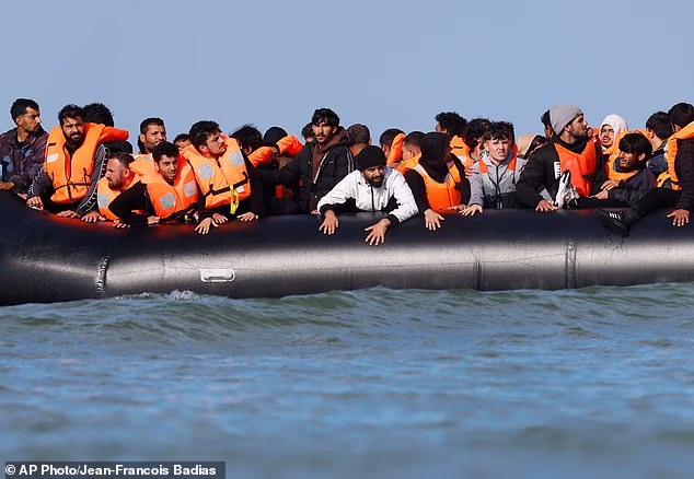 Under Labour, the number of small-boat migrants who have reached Britain is now larger than the entire British Army (Pictured: A group of migrants attempt to cross the English Channel on September 23)