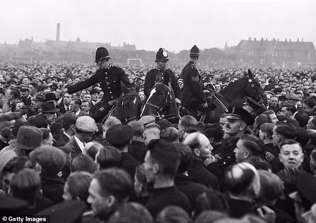 Police officers within a crowd of British Union of Fascists members during a Leeds rally in 1936