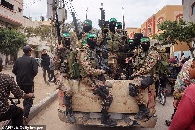 Hamas fighters pictured in Gaza. The ex-bodyguard to the leader of Hamas 'won UK asylum and citizenship' before allegedly plotting a terror attack against Jewish people in Europe