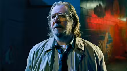 Gary Oldman looking worried in his customary tie and jacket in Slow Horses.