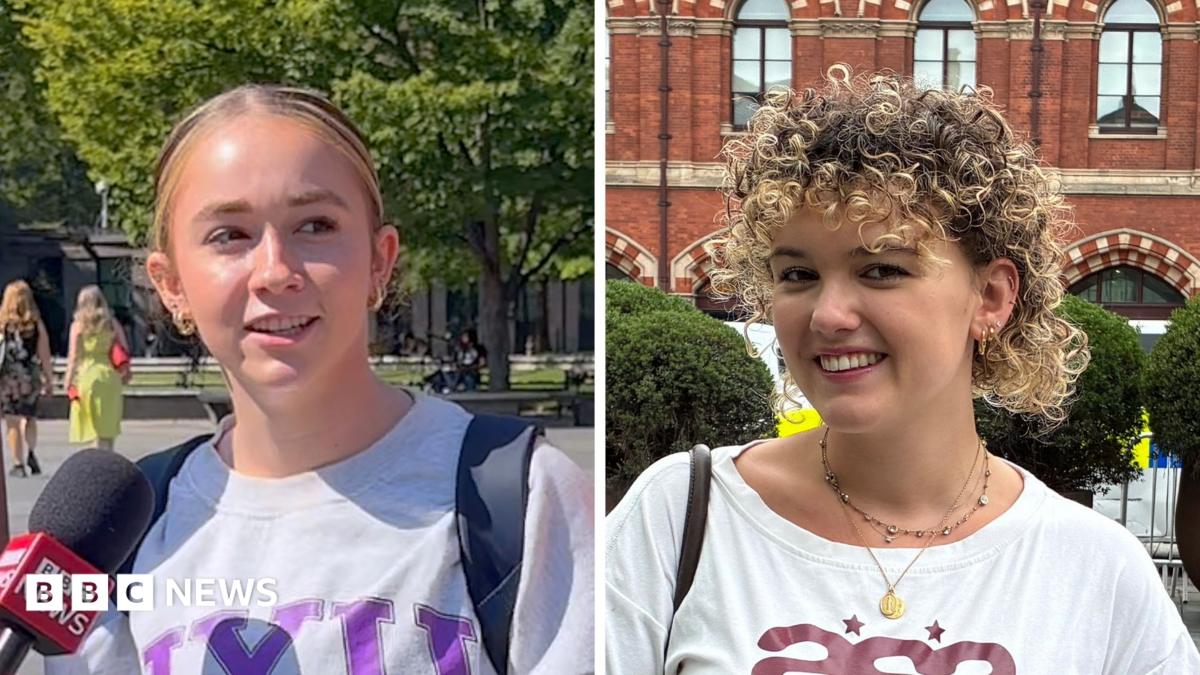 Composite image of two women. One woman has blonde hair tied back and wears a grey sweater; she is standing in a park speaking into a mic. The other woman has curly blonde hair and smiles standing in the street; she wears a white T-shirt.