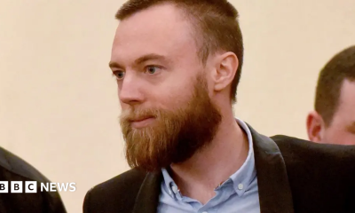 Jack Shepherd in court. He wears a shirt and jacket and has a beard