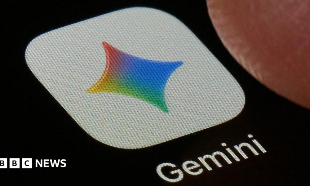A close-up shot of the Gemini application on a black screen. The icon is a white square with a four-point star in Google's colours, under which the word 'Gemini' is printed.