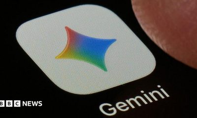 A close-up shot of the Gemini application on a black screen. The icon is a white square with a four-point star in Google's colours, under which the word 'Gemini' is printed.