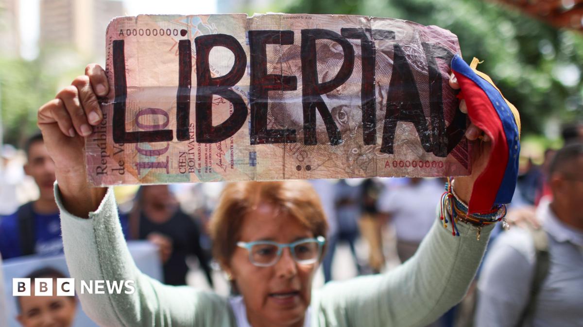 A woman holds a sign during a demonstration calling for the return of opposition leader Maria Corina Machado and free elections in Venezuela, in Caracas.