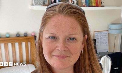 A woman with ginger hair looking at the camera.