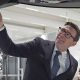 Prime Minister Andy Burnham looks at a car on the production line during a visit