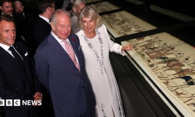 King Charles, President Macron and Queen Camilla looking at the Bayeux Tapestry