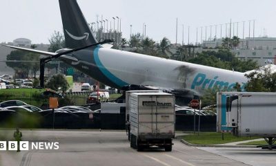 The plane sitting at a crooked angle to the ground