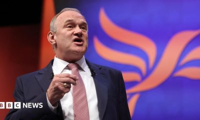 Ed Davey delivers speech to Lib Dem conference in suit and tie