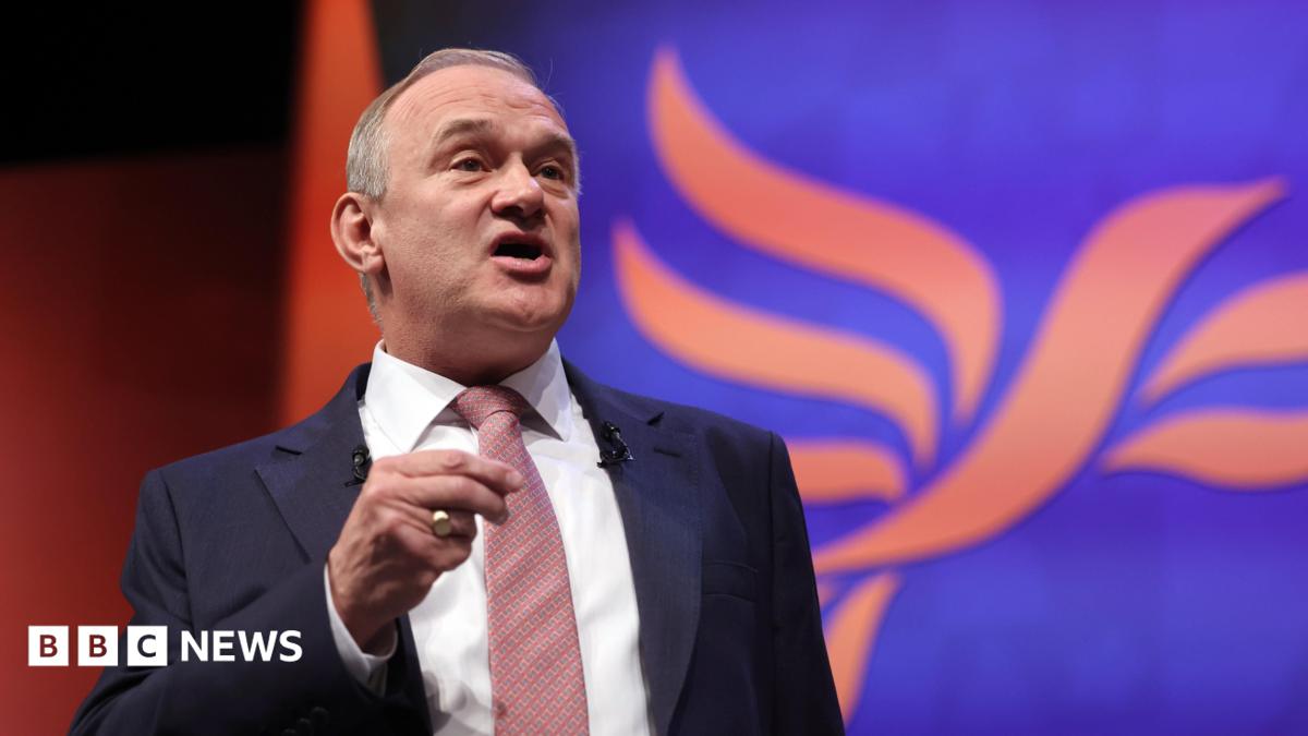 Ed Davey delivers speech to Lib Dem conference in suit and tie