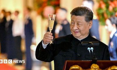 Chinese leader Xi Jinping raises his champagne flute during a toast at a state dinner in the White House hosted by US President Donald Trump