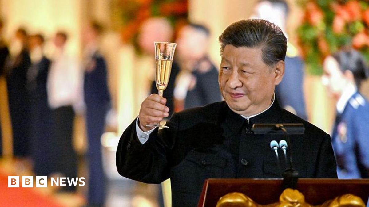 Chinese leader Xi Jinping raises his champagne flute during a toast at a state dinner in the White House hosted by US President Donald Trump