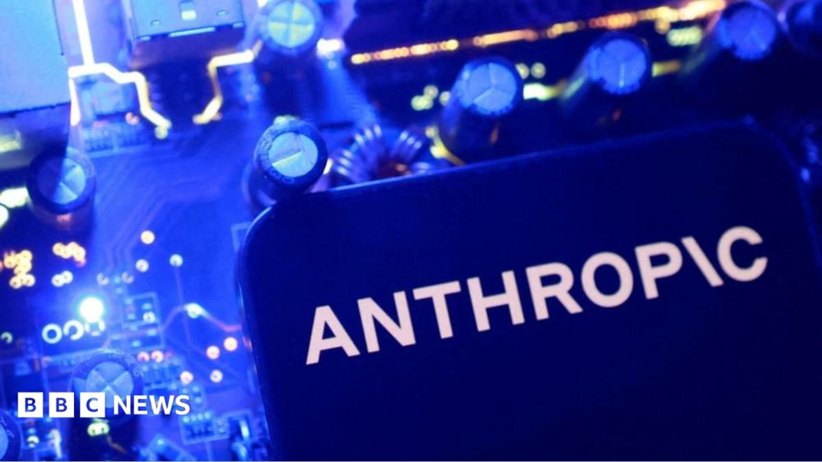 A smartphone display showing the Anthropic logo in black letters on an all-white background, laid on a laptop keyboard lit in pink and purple