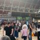 Crowds fill the concourse of London Paddington station with the departure boards blank showing no services.