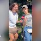Yasmin Rufo smiles while a young man points at the camera wearing jeans and a New York City T-shirt.