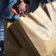 Woman carries Primark paper bags