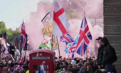 People demonstrate during the Tommy Robinson-led Unite the Kingdom march and rally, in London, Saturday Sept. 13, 2025.