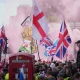 People demonstrate during the Tommy Robinson-led Unite the Kingdom march and rally, in London, Saturday Sept. 13, 2025.
