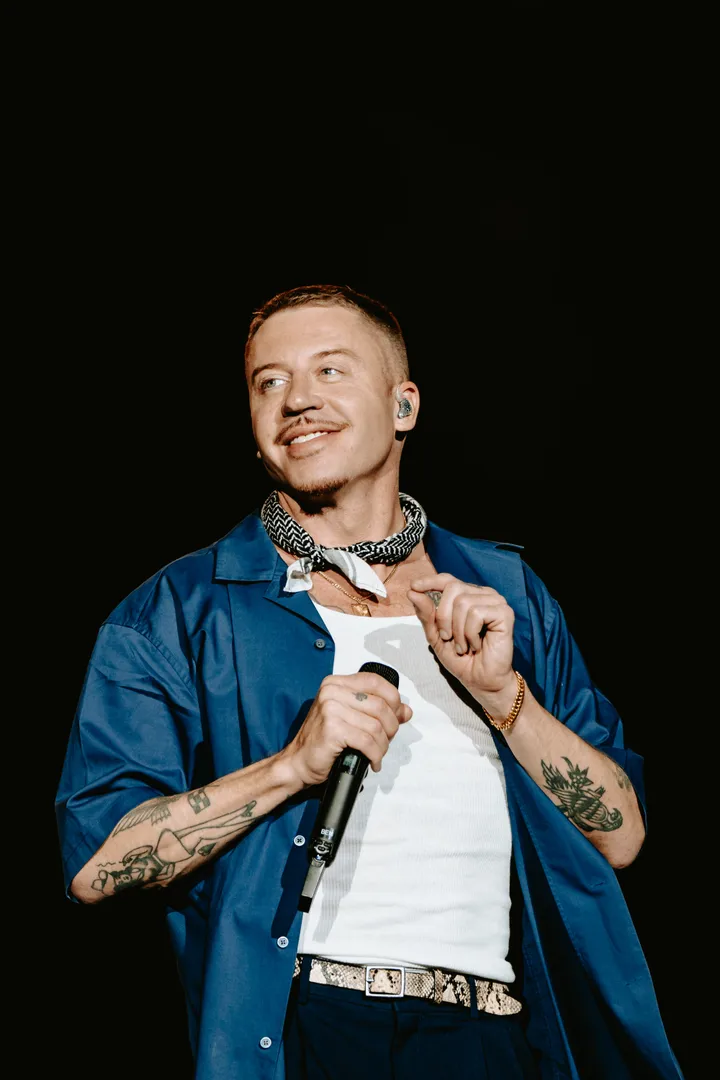 Macklemore performing in 2024