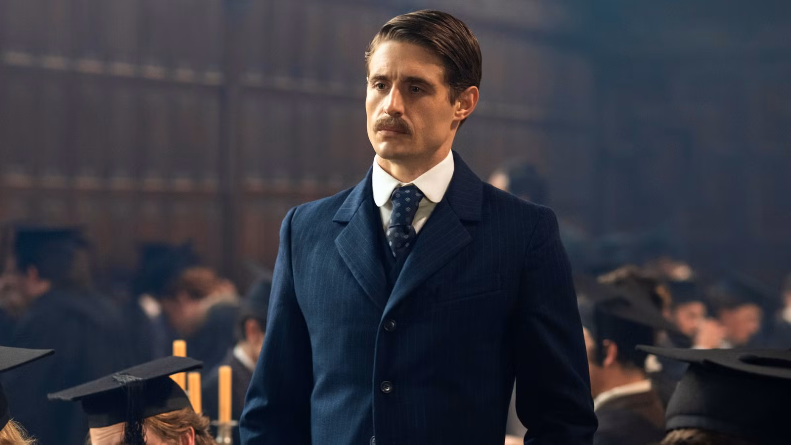 Max Irons standing in a university