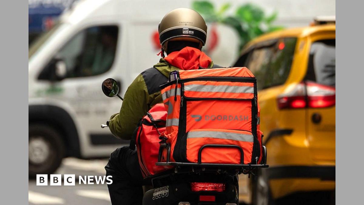 Person rides a moped with an brightly-coloured bag attached to the back with the logo reading Doordash