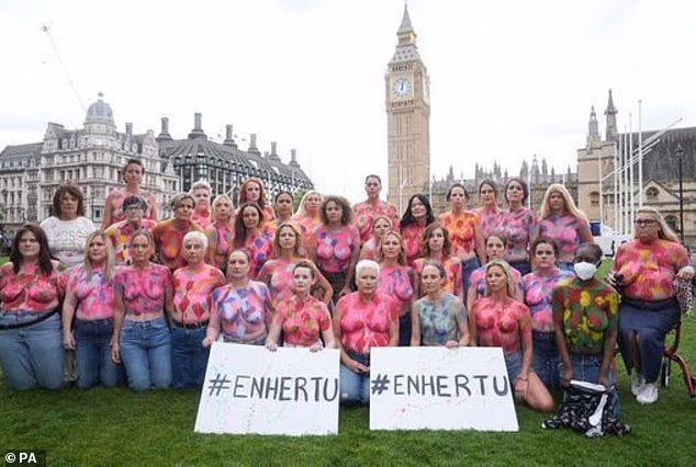 Campaigners in Westminster in July 2024 painted their breasts to send a message that Enhertu should be made available on the NHS