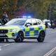 A police car is pictured on a road