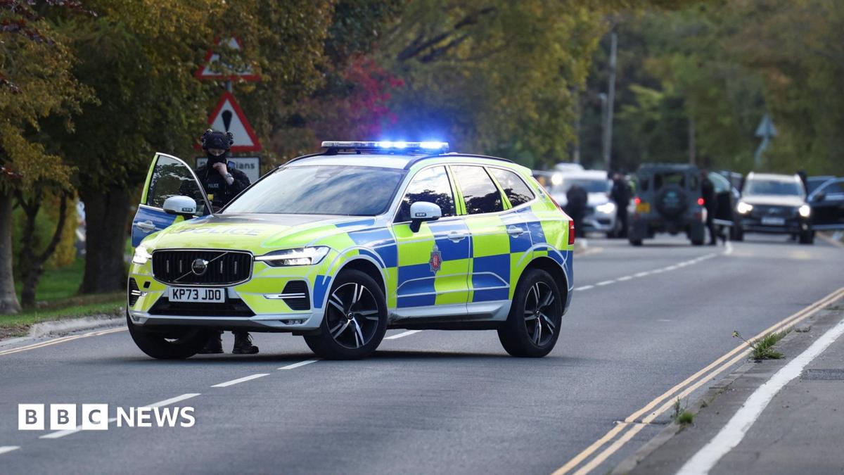 A police car is pictured on a road