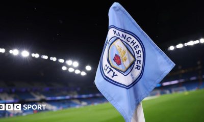 Manager Pep Guardiola applauds as his Manchester City players lift the FA Cup trophy after beating Chelsea in the 2026 final